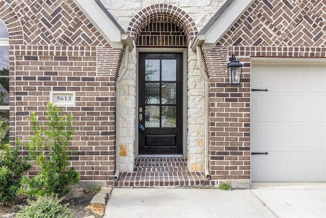 doorway to property featuring a garage