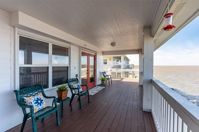 deck featuring a water view