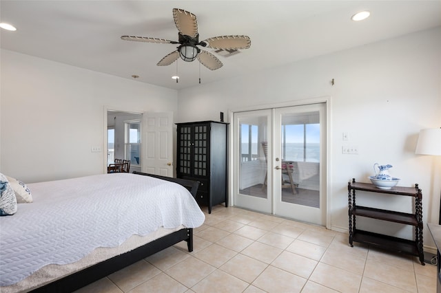 tiled bedroom featuring access to exterior, ceiling fan, and multiple windows