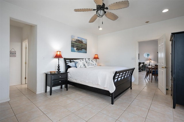 bedroom with ceiling fan and light tile patterned floors