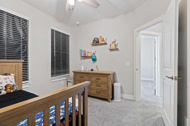 bedroom with light carpet and ceiling fan