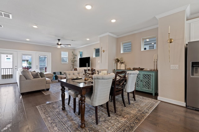 dining space with ceiling fan, dark hardwood / wood-style flooring, ornamental molding, and french doors