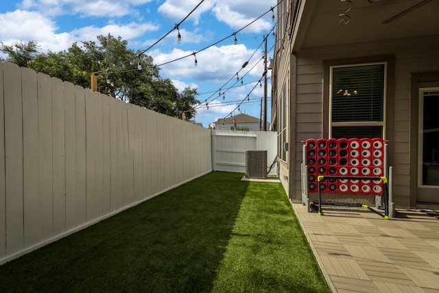 view of yard with central AC unit