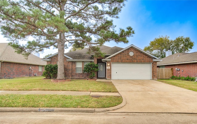 ranch-style home featuring a garage and a front yard