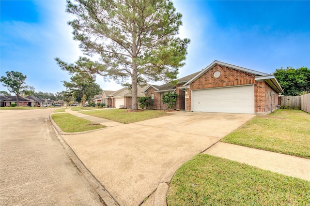 single story home with a garage and a front lawn