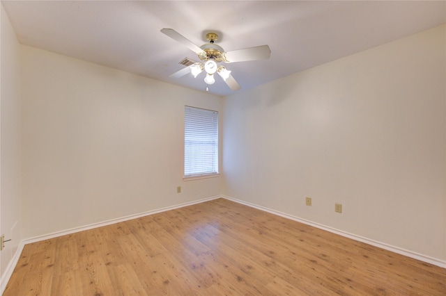 empty room featuring ceiling fan and light wood-type flooring