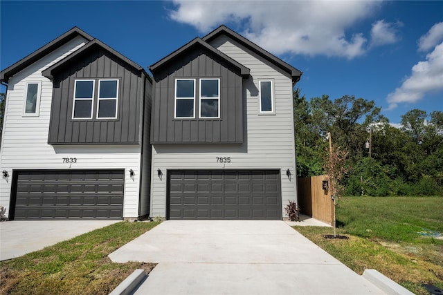 view of front of home with a garage and a front yard