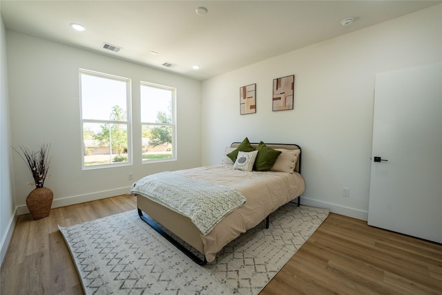 bedroom with light hardwood / wood-style flooring