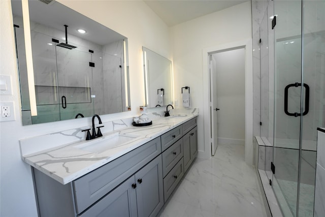 bathroom featuring vanity and a shower with shower door