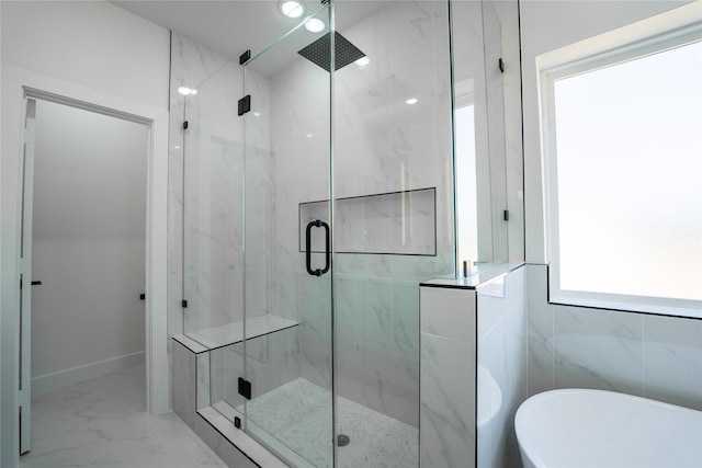 bathroom featuring shower with separate bathtub