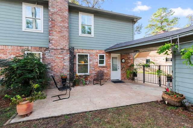 rear view of house featuring a patio