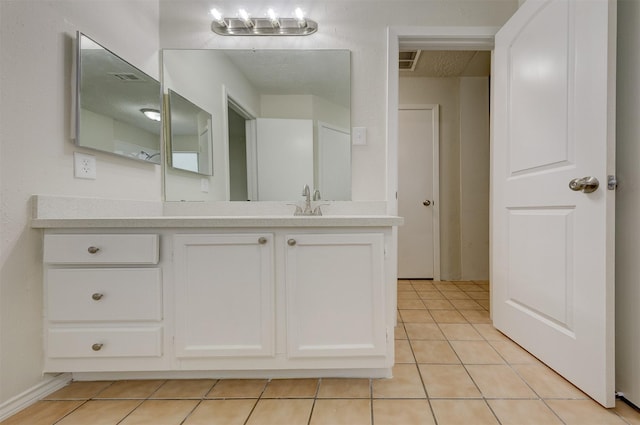 bathroom featuring tile patterned floors and vanity