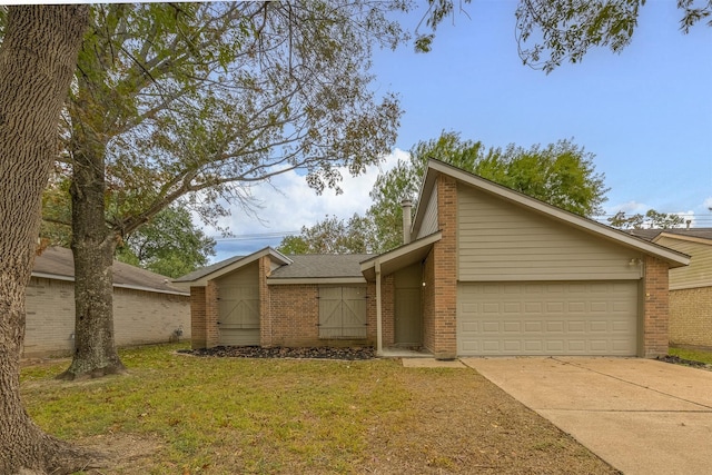 ranch-style home featuring a front lawn and a garage