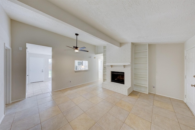 unfurnished living room with light tile patterned floors, a textured ceiling, a brick fireplace, and ceiling fan