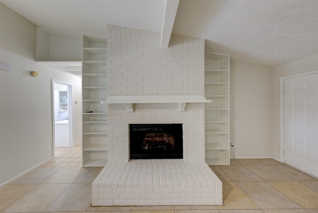 unfurnished living room with a textured ceiling, a fireplace, light tile patterned floors, and vaulted ceiling