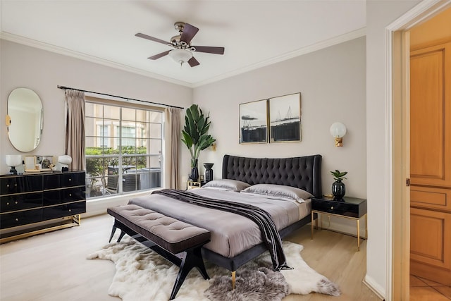 bedroom with ceiling fan, light wood-type flooring, and ornamental molding