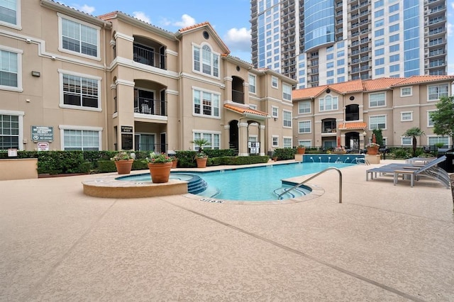 view of pool featuring a patio area