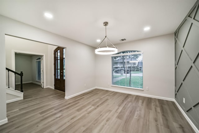 unfurnished dining area with wood-type flooring