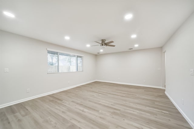 unfurnished room featuring light hardwood / wood-style flooring and ceiling fan