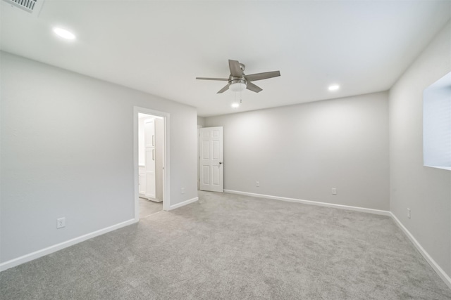 empty room with light carpet and ceiling fan