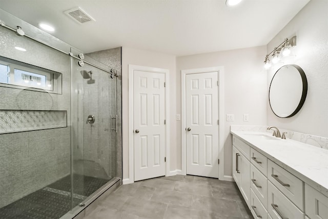 bathroom featuring vanity and walk in shower