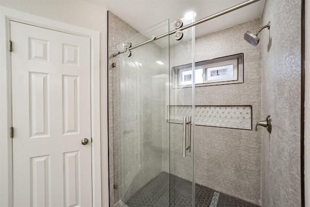 bathroom featuring walk in shower