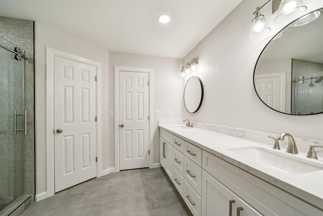 bathroom featuring vanity and an enclosed shower