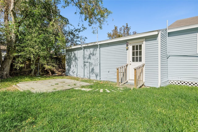 view of outbuilding featuring a lawn