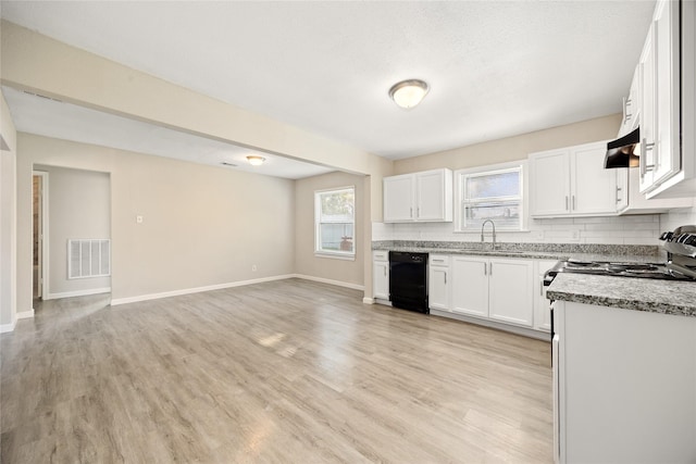 kitchen with white cabinets, dishwasher, sink, and light hardwood / wood-style flooring