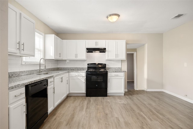 kitchen featuring light stone counters, sink, black appliances, light hardwood / wood-style flooring, and white cabinets