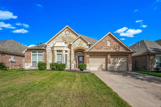 view of front property with a front lawn and a garage