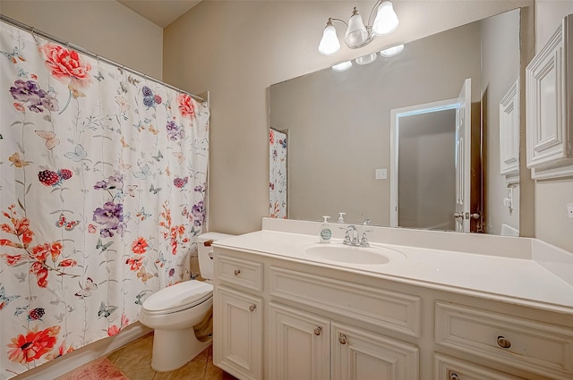 bathroom featuring tile patterned flooring, vanity, a shower with shower curtain, and toilet