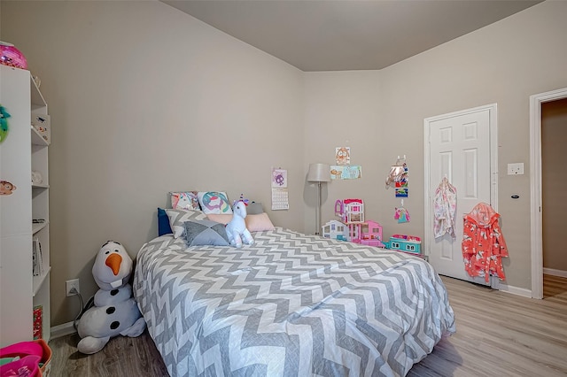 bedroom with light wood-type flooring