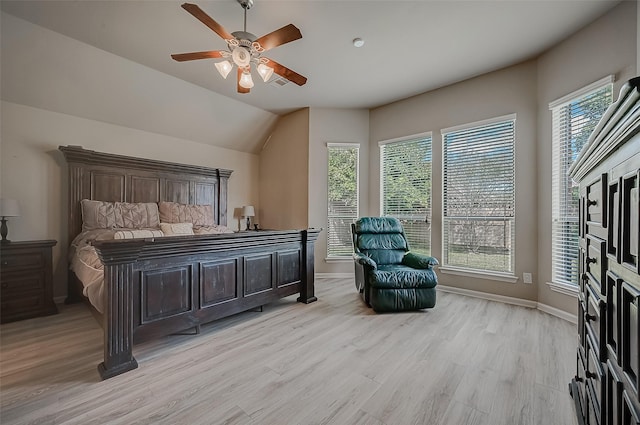 bedroom with light wood-type flooring, ceiling fan, and lofted ceiling