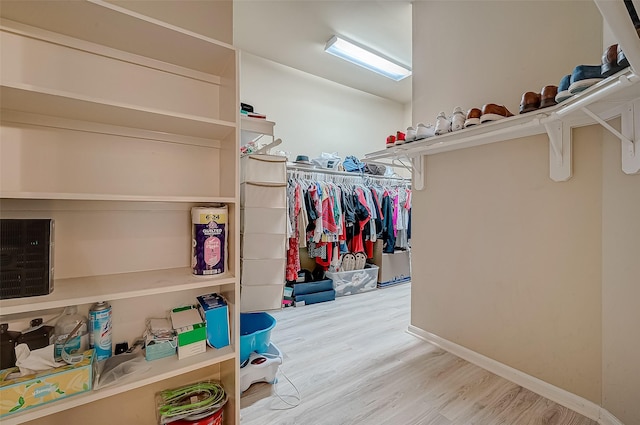 spacious closet featuring hardwood / wood-style flooring