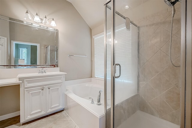 bathroom featuring plus walk in shower, tile patterned floors, vanity, and vaulted ceiling