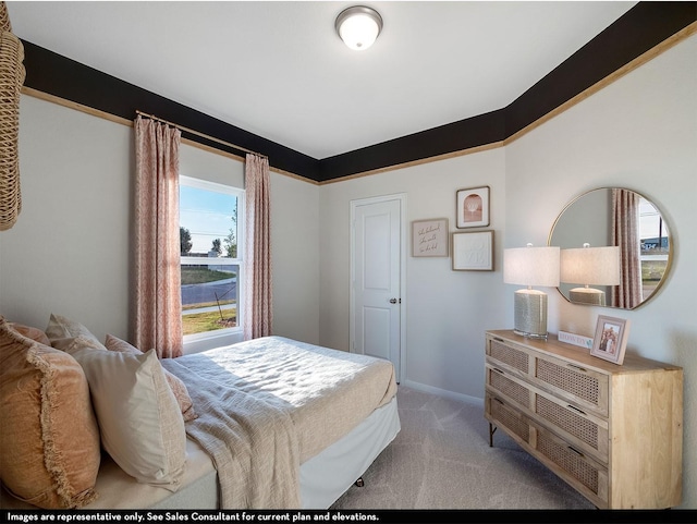 bedroom featuring light colored carpet