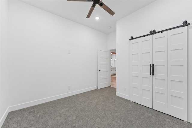 unfurnished bedroom with carpet flooring, a closet, and ceiling fan