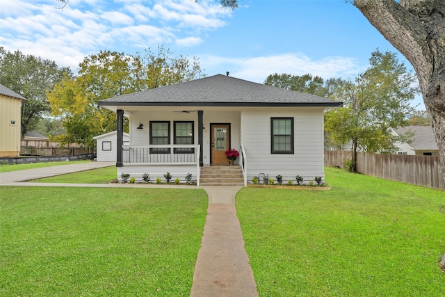 bungalow-style house with a front yard and a porch