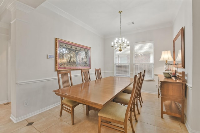 dining space featuring crown molding, light tile patterned flooring, and an inviting chandelier