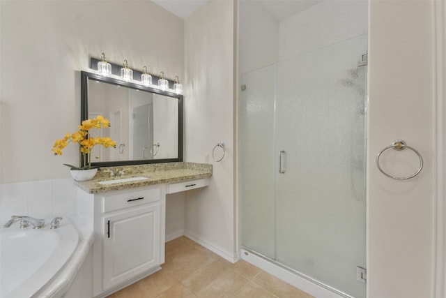 bathroom with tile patterned flooring, vanity, and separate shower and tub