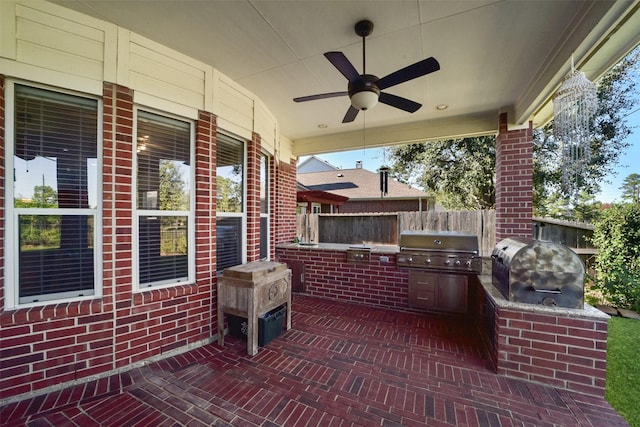 view of patio / terrace with ceiling fan, an outdoor kitchen, and grilling area