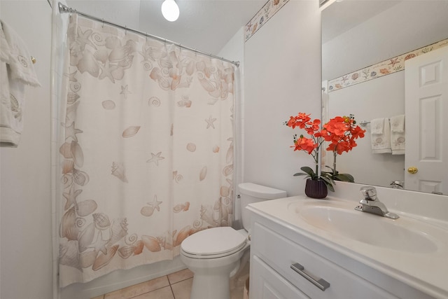 full bathroom with vanity, toilet, tile patterned floors, and shower / bath combo with shower curtain