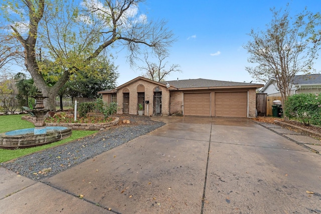 ranch-style home featuring a garage