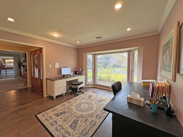 office with crown molding, dark hardwood / wood-style flooring, and a textured ceiling