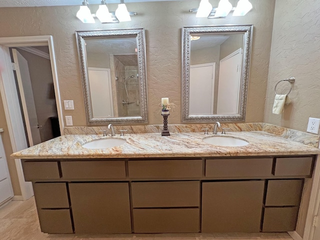 bathroom with a shower and vanity