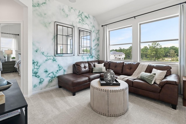 carpeted living room with lofted ceiling