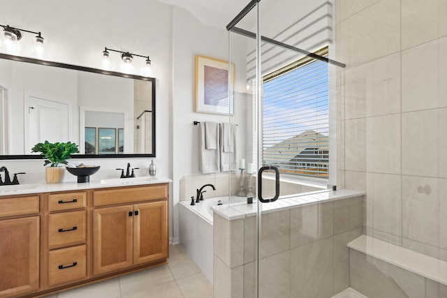 bathroom with vanity, tile patterned floors, and independent shower and bath