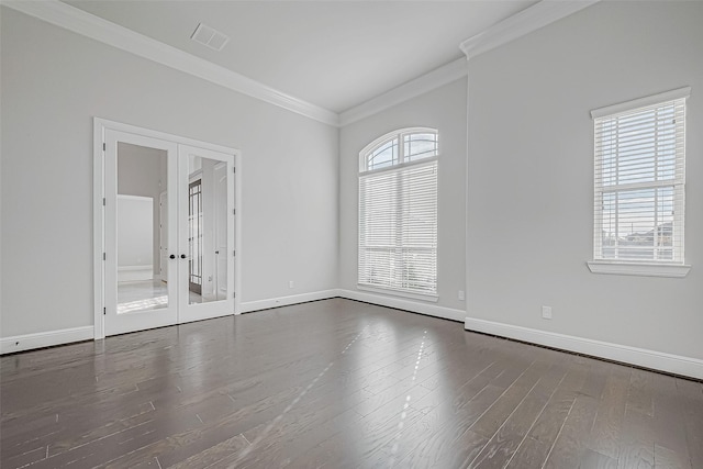 empty room featuring hardwood / wood-style floors, ornamental molding, french doors, and a healthy amount of sunlight