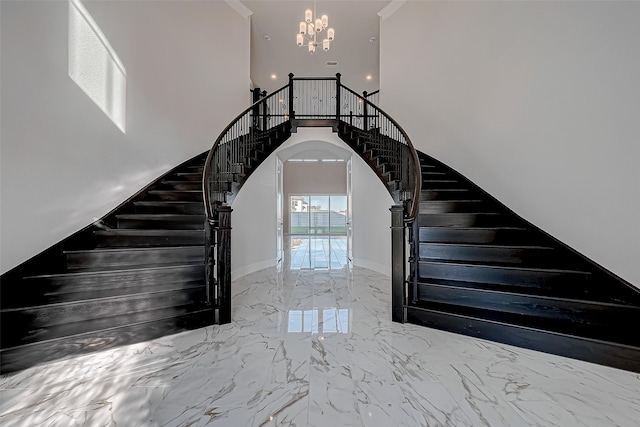 stairs with a high ceiling and a chandelier